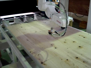 接着剤を吹き付けるロボット 接着剤を吹き付けるロボット